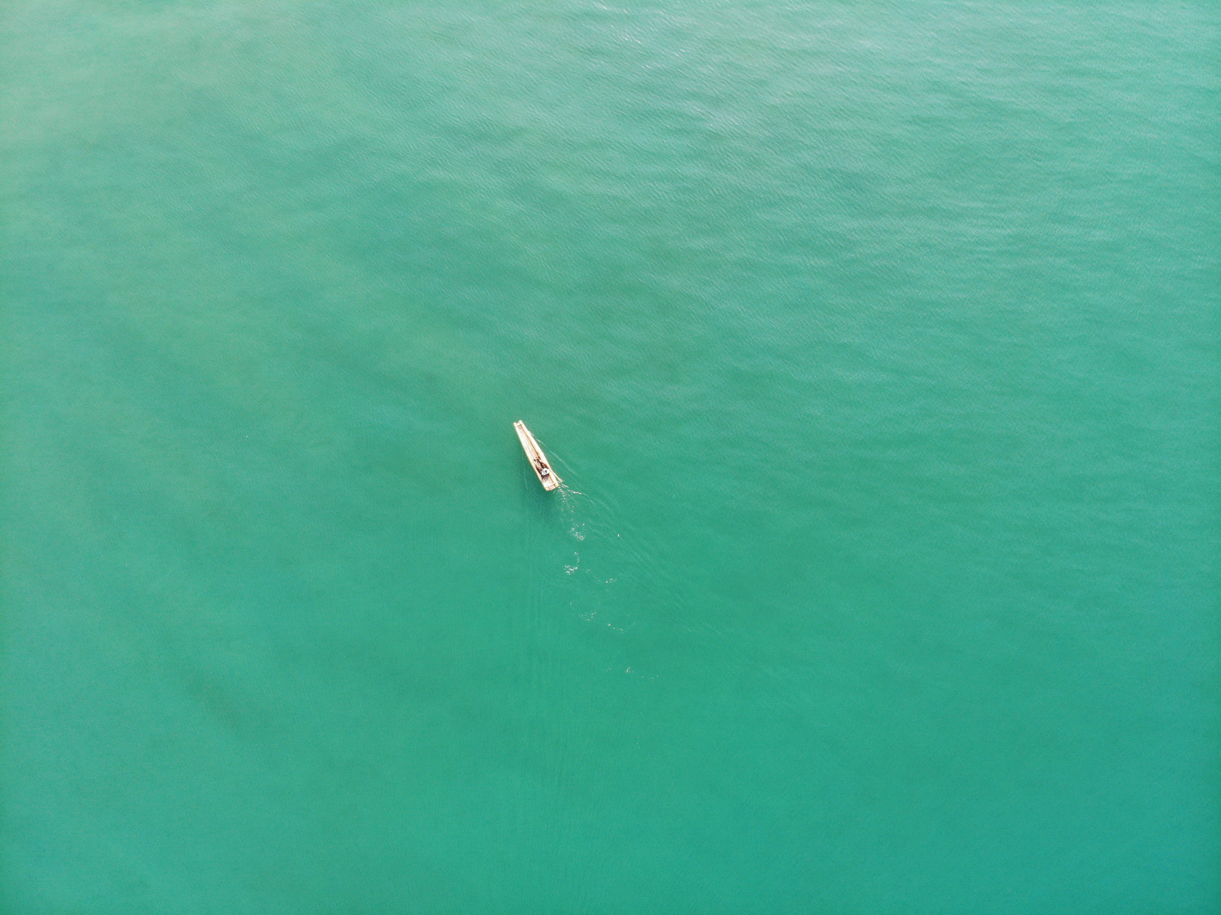 aerial view of boat on sea during daytime